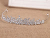 Bridal silver tiara with peaks of sparkling gemstones in a flowing floral pattern