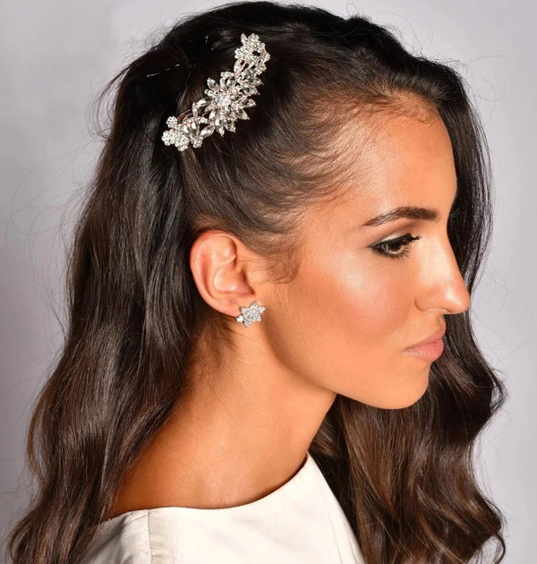 Woman with Rose gold floral crystal bridal hair comb on marble background