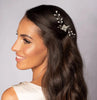 Woman with Pearls and crystals hair pin for brides on burlap background