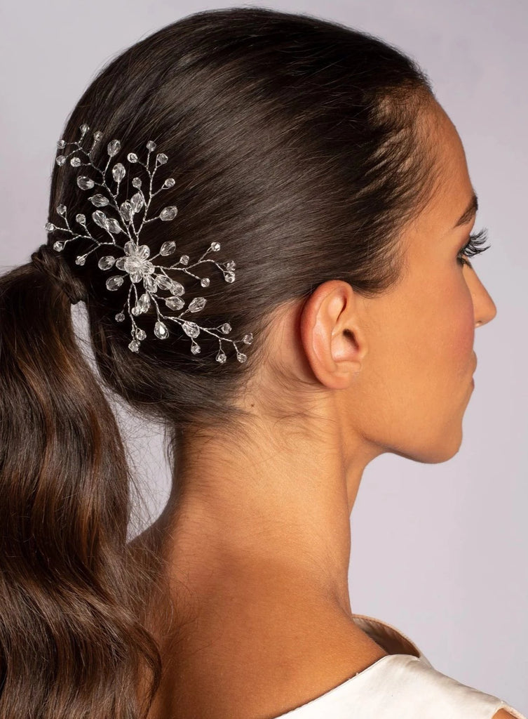 Woman with Crystal bridal hair comb on a white background 