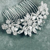 Silver floral crystal bridal hair comb on gray background