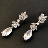 silver swarovski crystal rain drop earrings on a black background